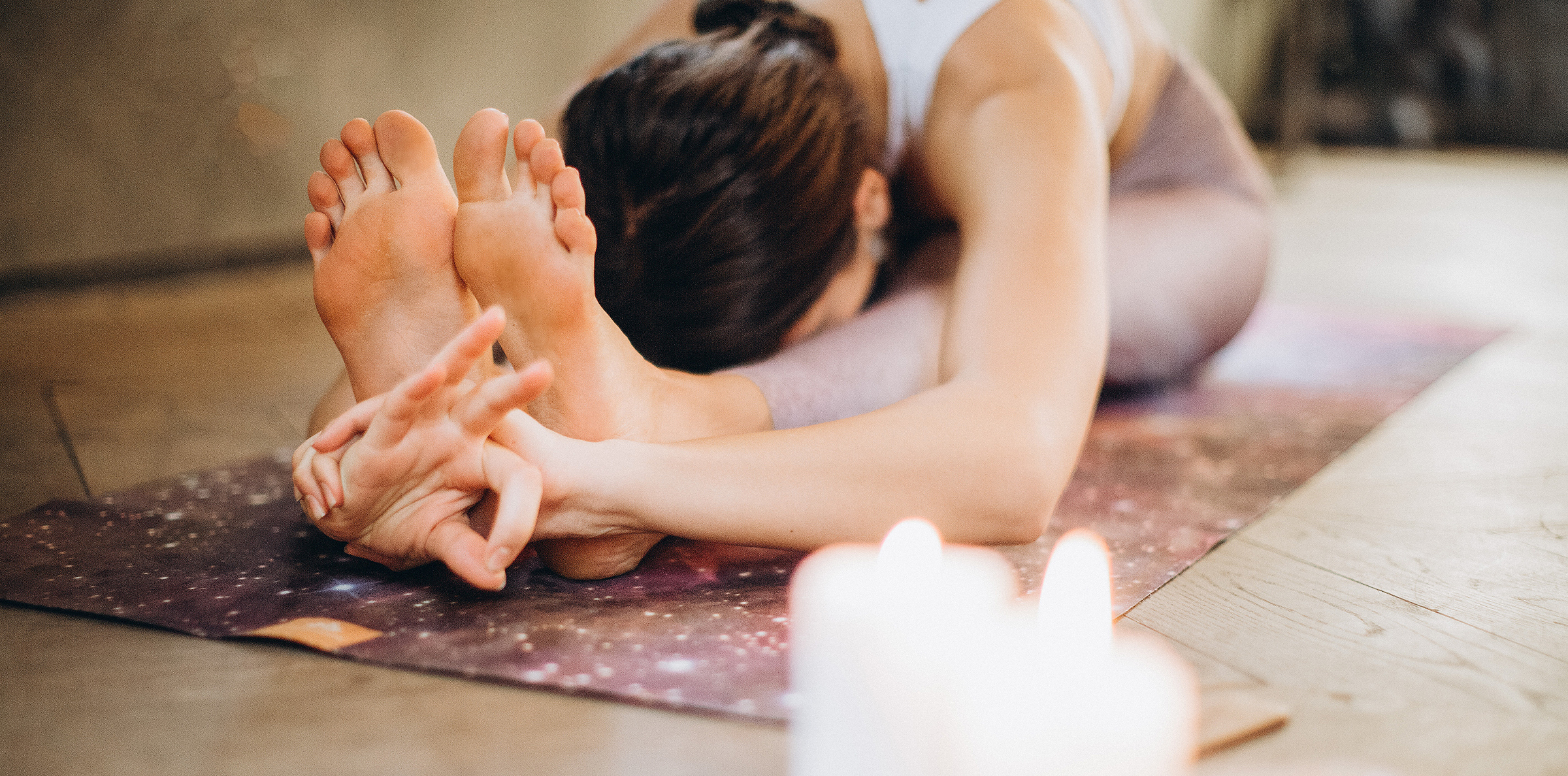 passive-assisted-stretching woman stretching into yoga pose